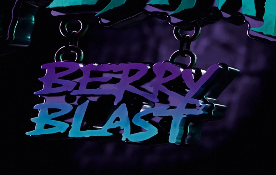 Close view of the Berry Blast plate hanging under the FLAME sign on two short chains, each a ring, one link and a ring