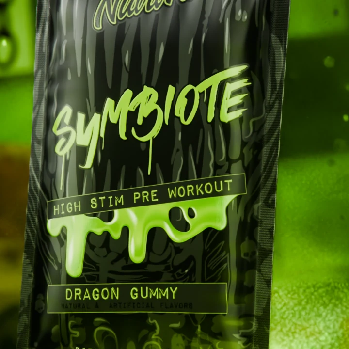 Close-up of the Symbiote logo and green drips on the black foil sachet