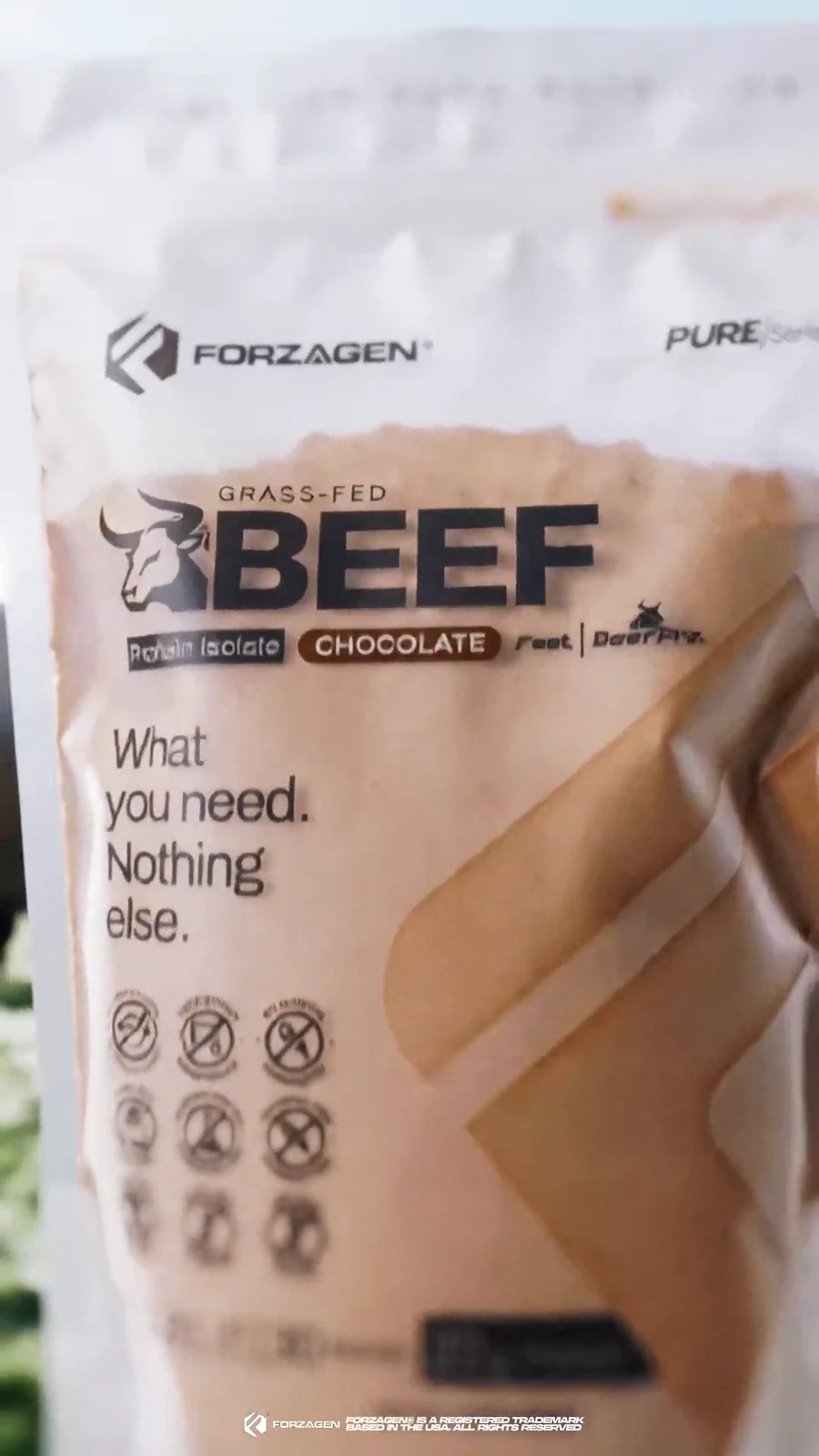 Close hero view of a Forzagen Pure Beef chocolate protein bag.