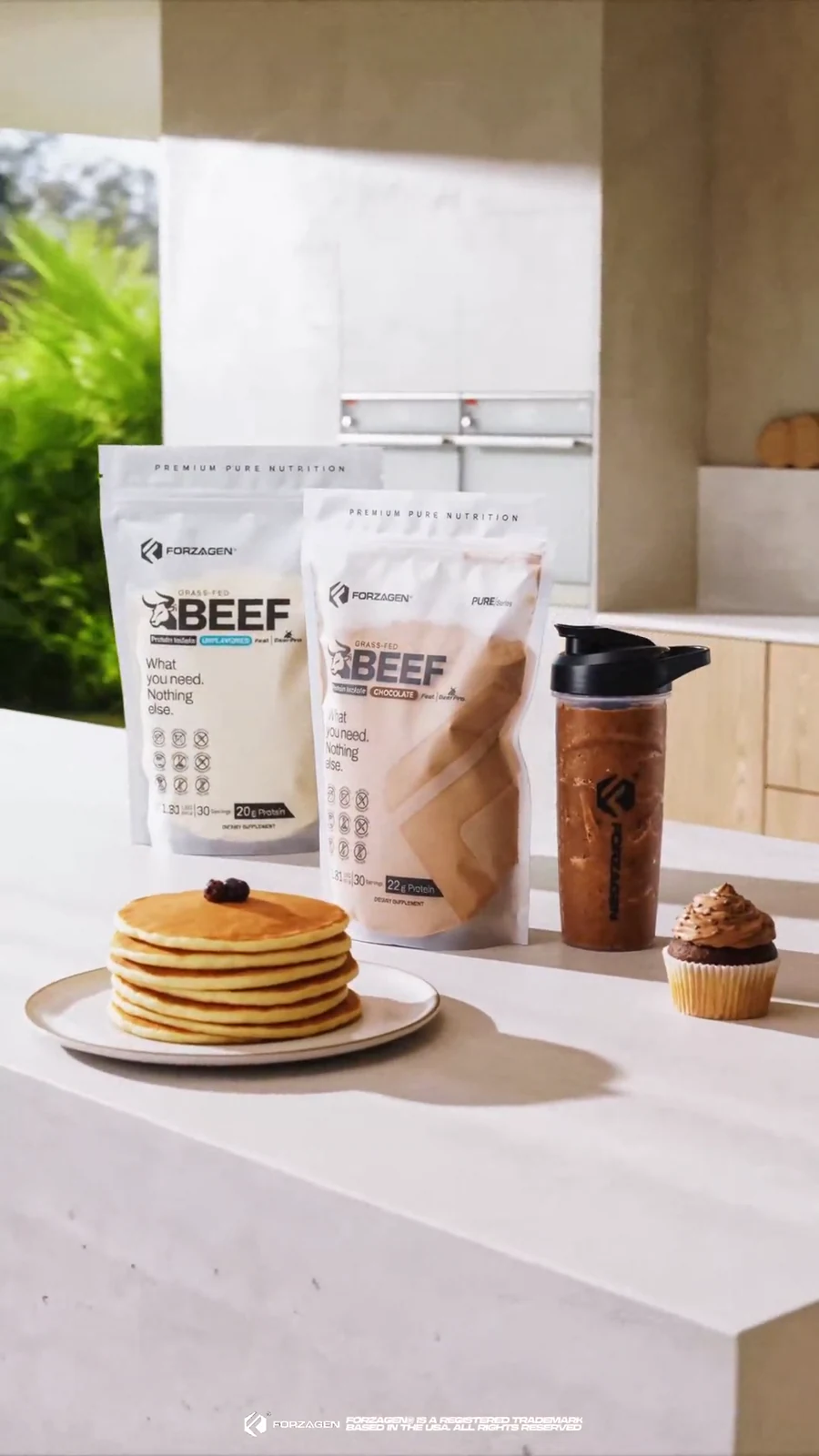 Pure Beef bags, shaker, pancakes and muffin arranged in a bright kitchen breakfast scene.