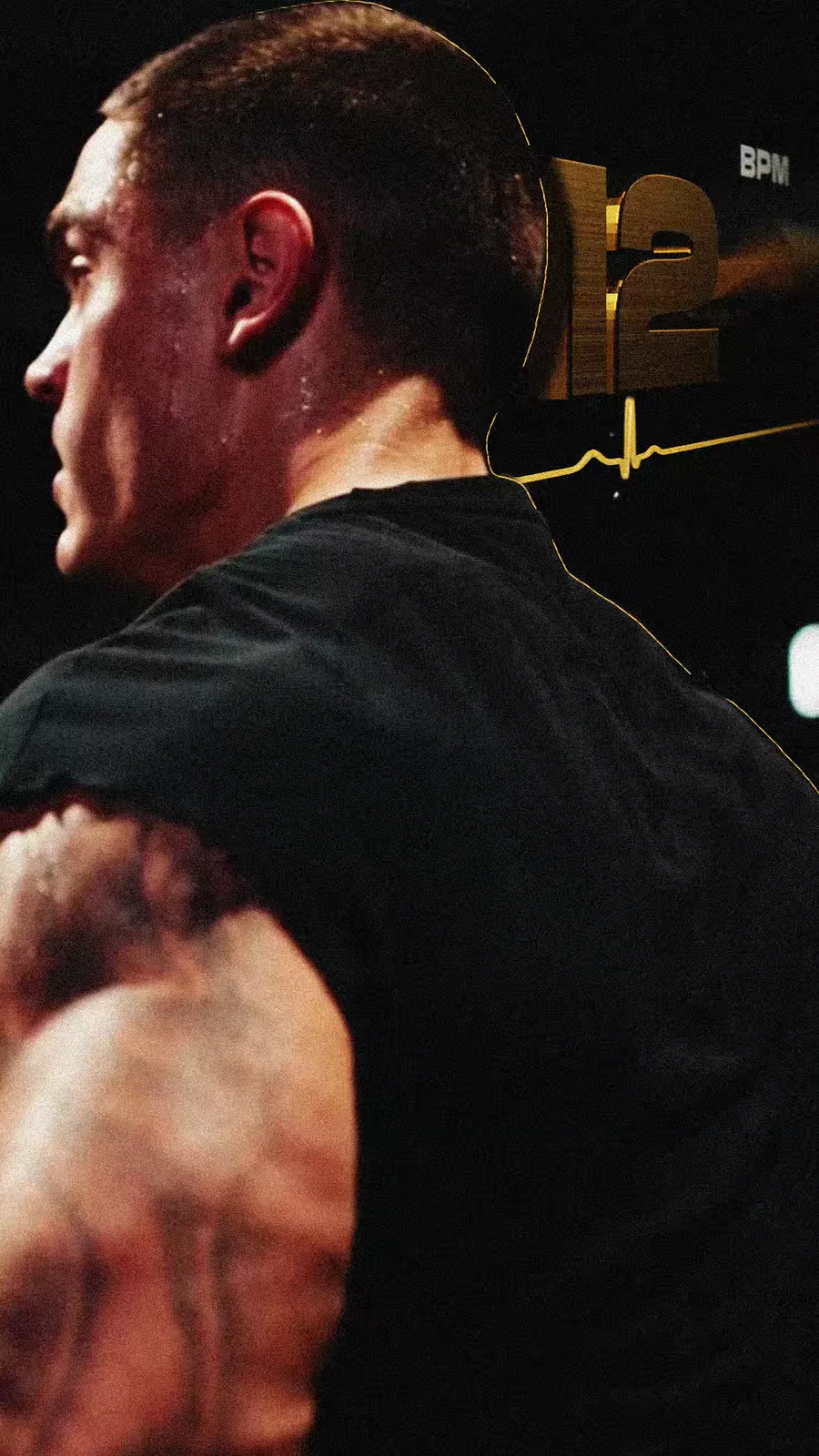 Sweating athlete seen from behind in a dark gym with a gold heart-rate readout floating beside him.