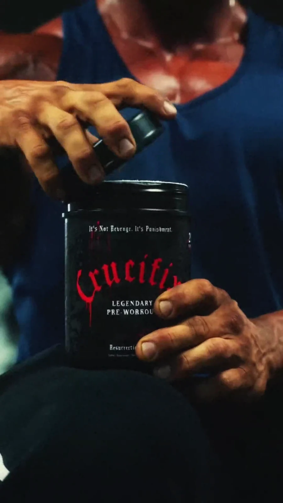 Lee Priest opens the Crucifix pre-workout tub in a tight product ritual.