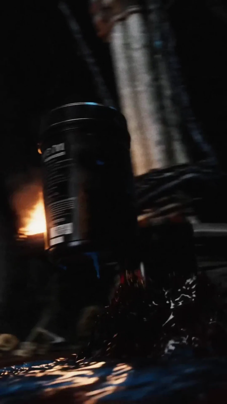 Single black Holy Water tub emerges from rippling liquid beside cathedral firelight.