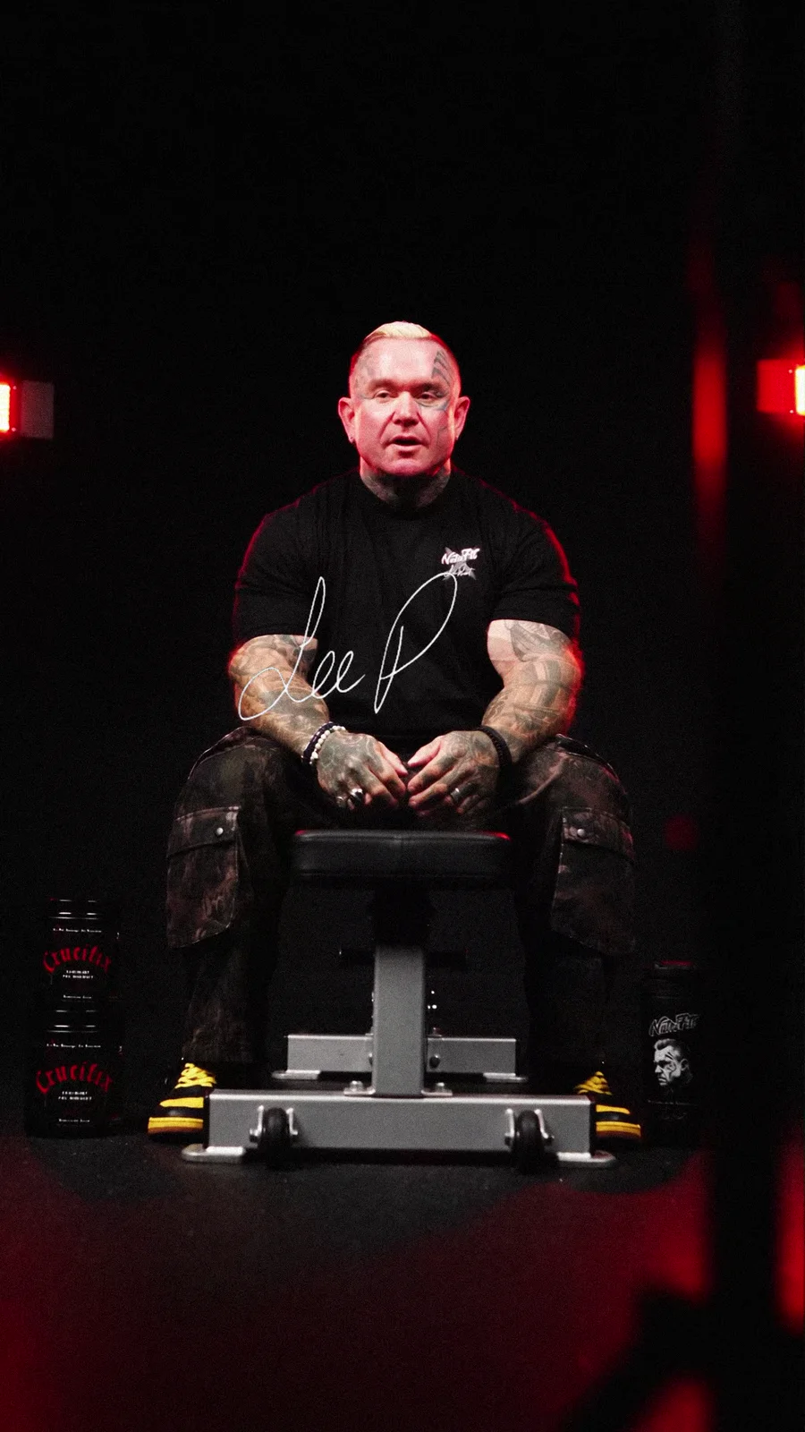 Lee Priest seated against a dark background beneath the title About Bodybuilding.