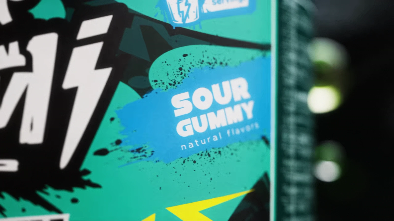 Macro detail of the Sour Gummy flavor panel on an Ommi Pure Stim label.