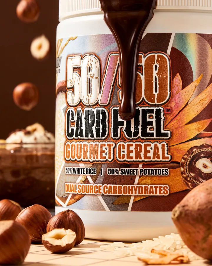 Chocolate pours over a 50/50 Carb Fuel tub surrounded by falling hazelnuts.