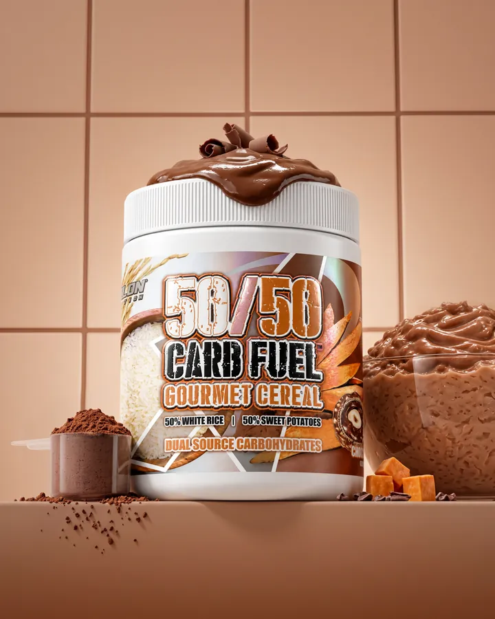A 50/50 Carb Fuel tub topped with chocolate hazelnut spread on a warm tiled set beside a chocolate cereal cup and a scoop.