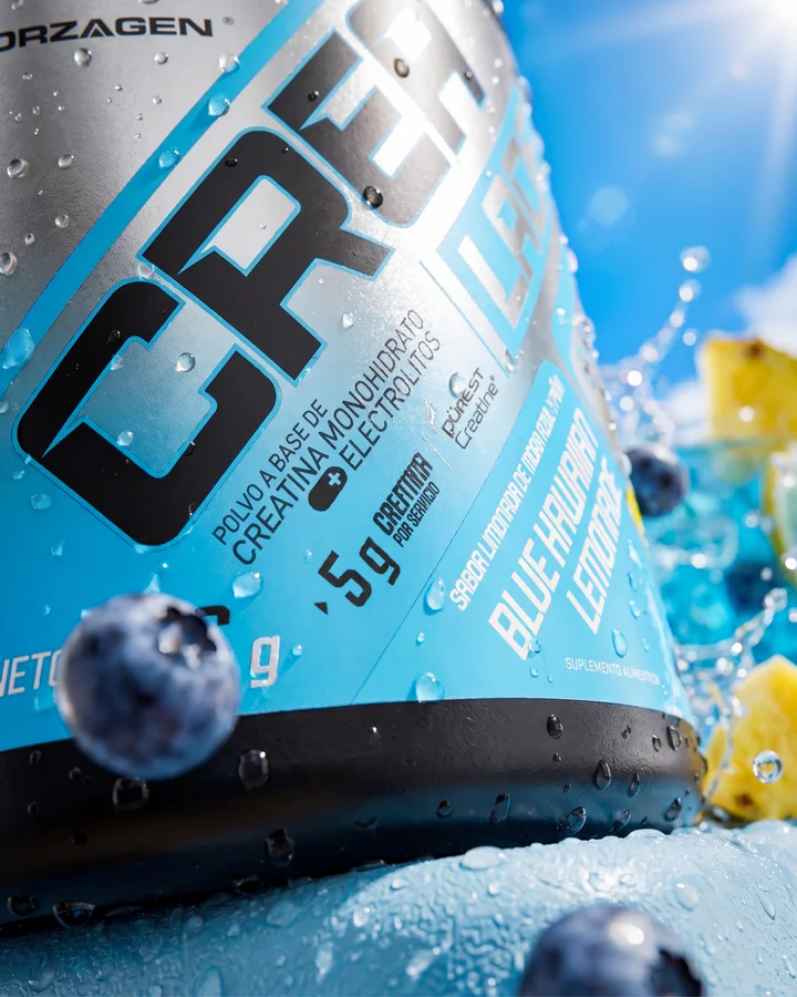 Wet blue Forzagen CREA LADE tub fills the frame with blueberries, citrus and bright-blue liquid behind it.