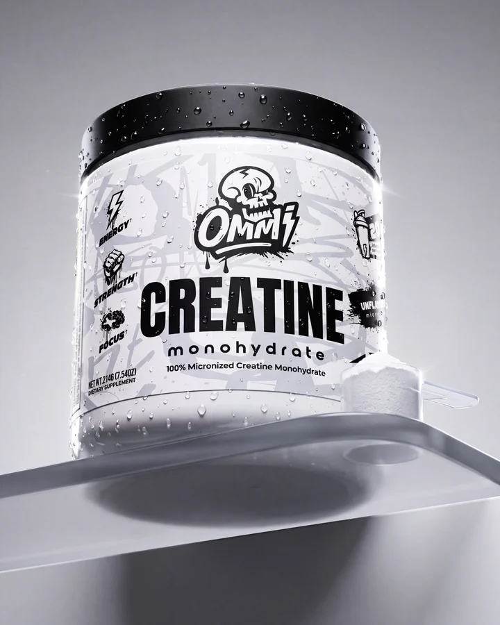 Ommi Creatine Monohydrate tub stands on a reflective silver platform in a clean black-and-white product frame.
