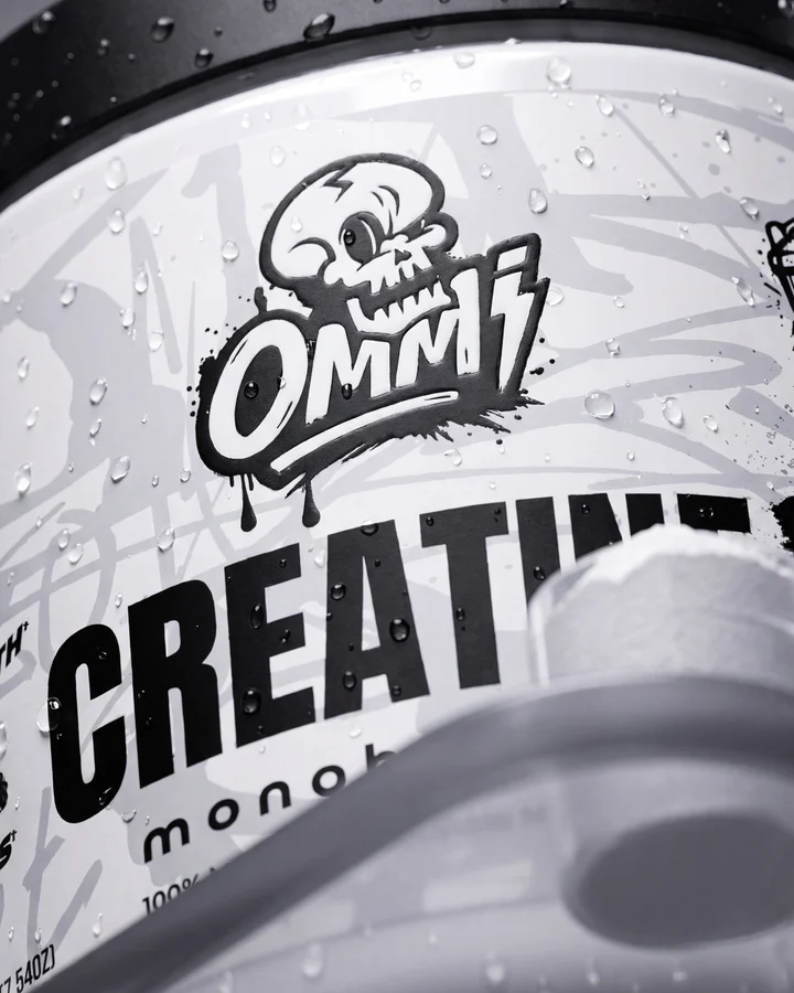Close black-and-white view centers the Ommi skull mark and bold Creatine lettering.