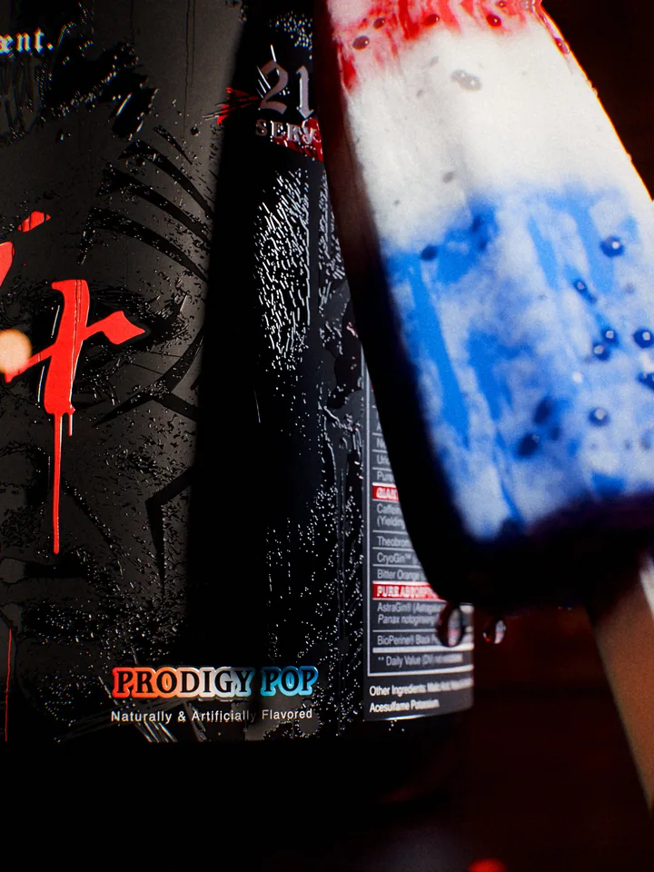 Macro of the Prodigy Pop flavor panel on the Crucifix label beside the popsicle.