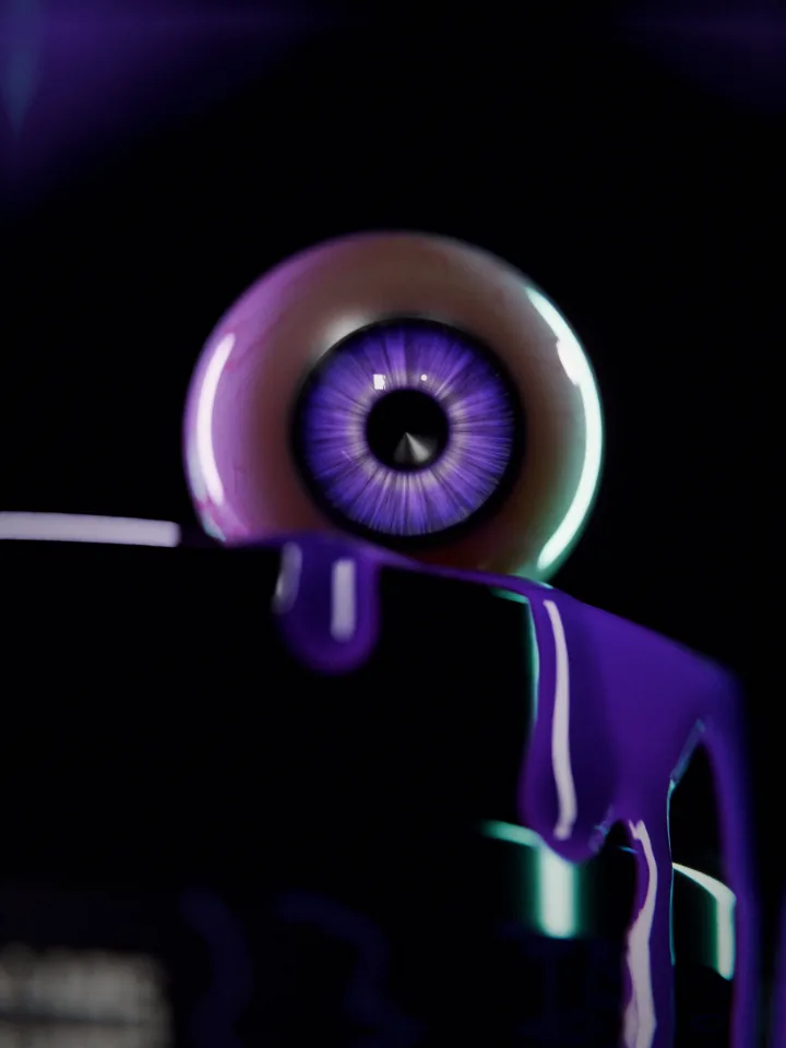 Macro of an eyeball with a purple iris sitting on the lid of the FLAME tub, purple liquid pouring over the rim in front of it.