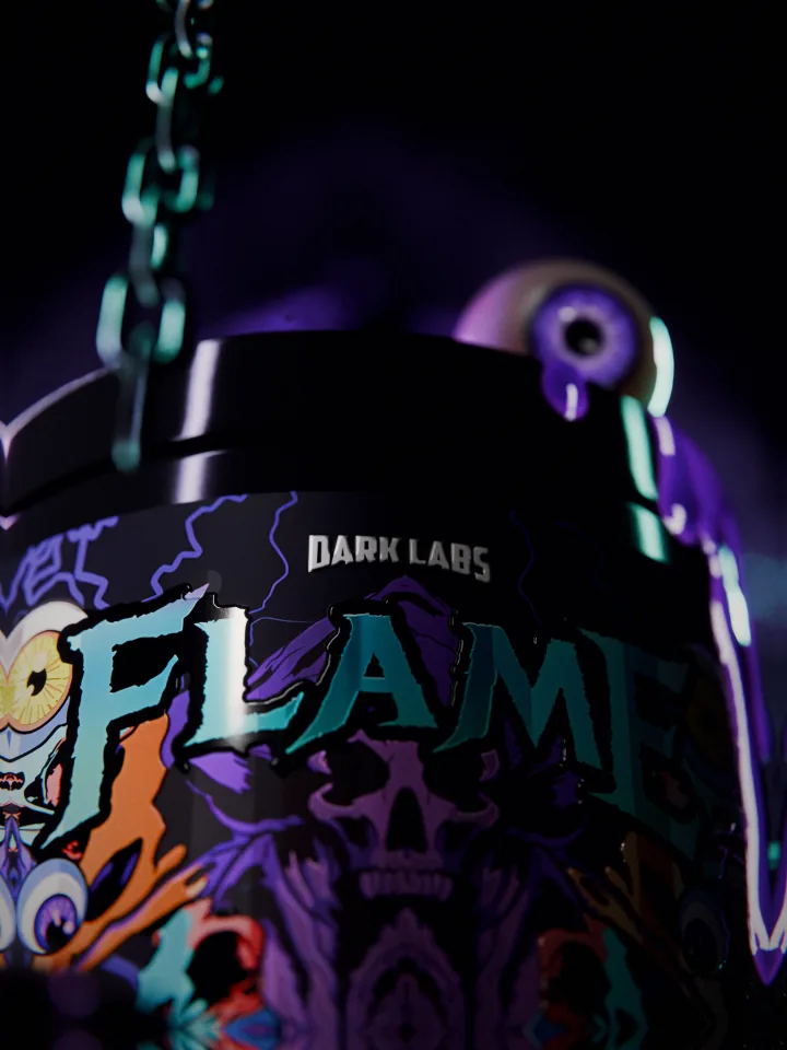 Low macro of the teal FLAME name on the tub seen from the floor, a chain out of focus in front and the lid eye above with liquid running down.