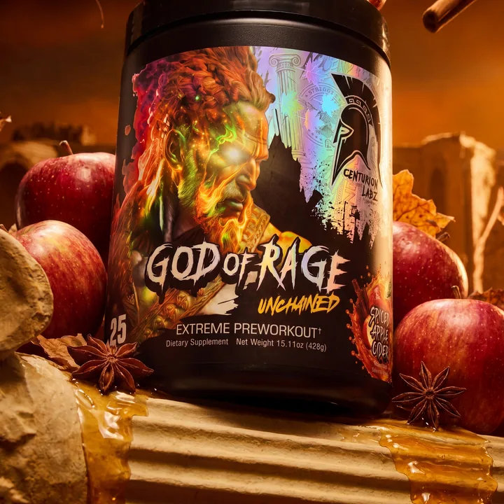 Low three-quarter close-up of the God of Rage label on Roman stone, framed by wet apples, star anise and amber cider drips.