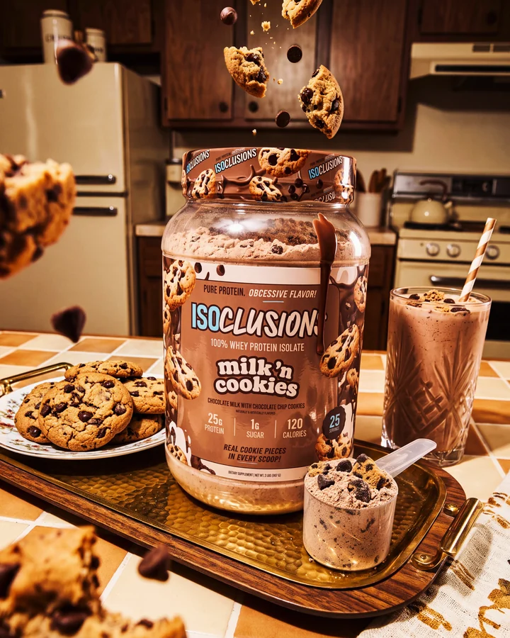 ISOCLUSIONS Milk 'n Cookies tub in a warm kitchen with floating chocolate chips, cookies and a chocolate shake.