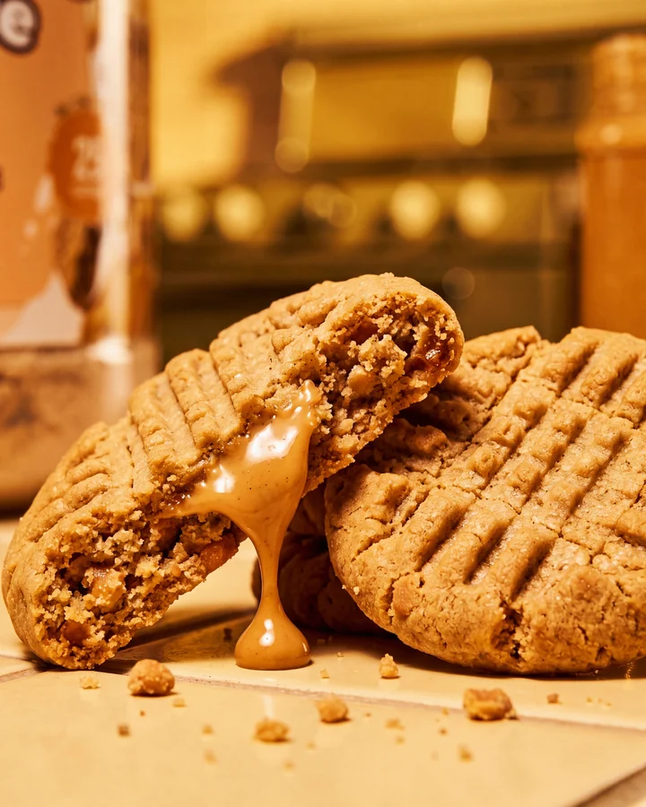 ISOCLUSIONS Broken peanut butter cookies with a glossy peanut butter center.