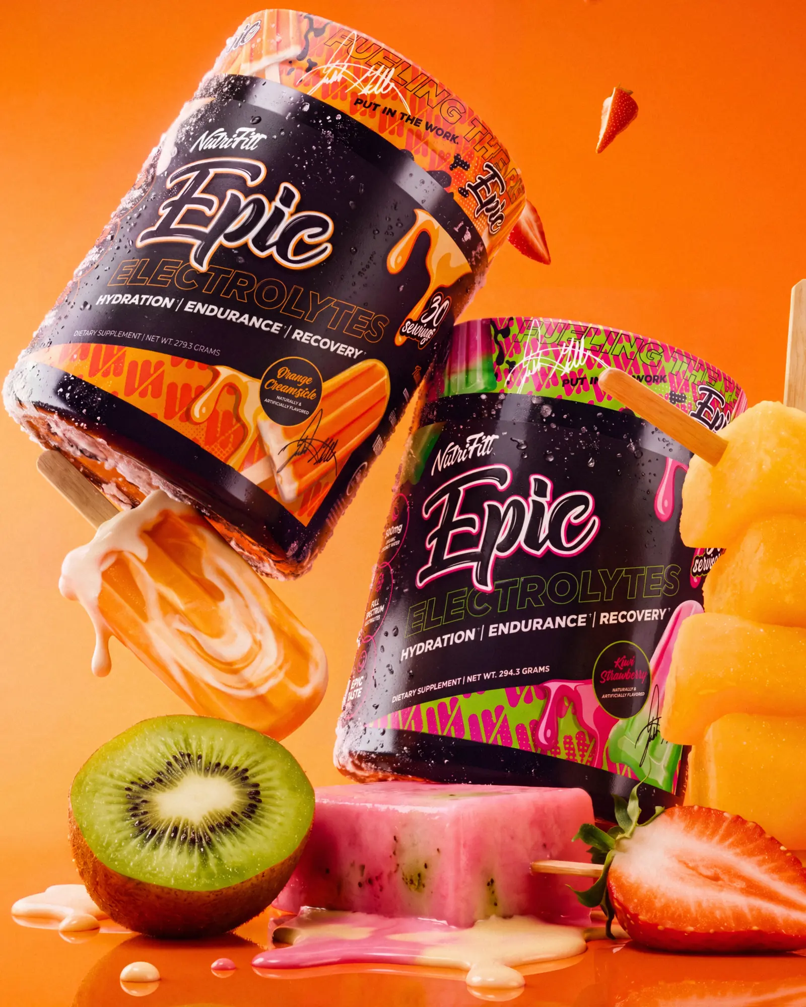 Two NutriFitt Epic Electrolytes tubs in a vivid frozen fruit world of orange, pink and green.
