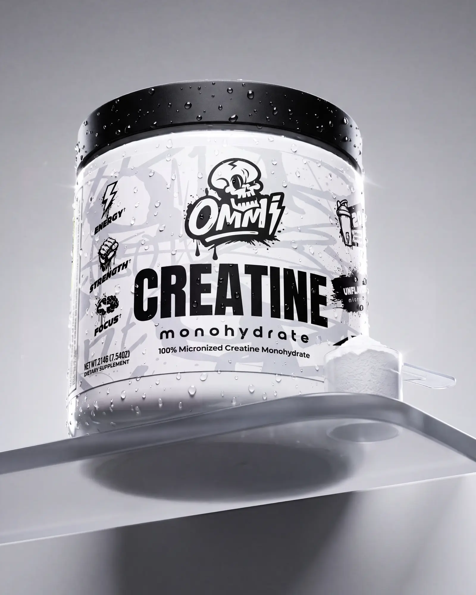 White Ommi Creatine Monohydrate tub on a minimal translucent white product set.
