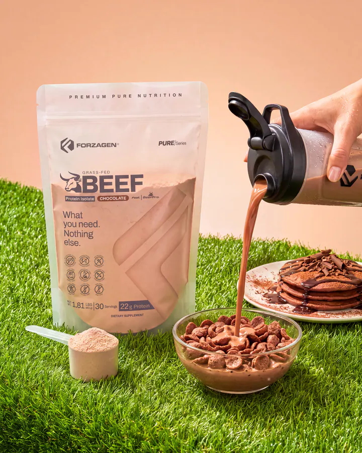 Pure Beef Chocolate protein bag with cereal, pancakes and chocolate drink pouring from a shaker.