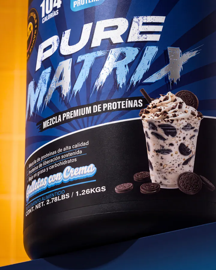 Macro product view of the Pure Matrix cookies-and-cream label beside a finished shake.